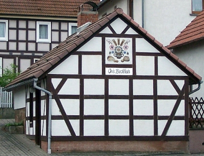 Whitewashed bake house with timber framing